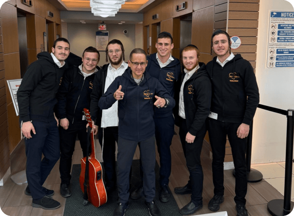 A Healing Melodies volunteer bringing music and joy